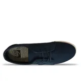 Championes Reef azules de tela con suela blanca.