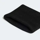 Par de muñequeras deportivas Adidas, color negro, con el logo de las tres barras bordado en blanco.
