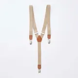 Tirantes elásticos en color beige con detalles de cuero sintético marrón y clips metálicos plateados.