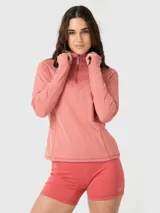 Remera de manga larga con medio cierre frontal y cuello alto. Confeccionada en tela suave con diseño entallado y aberturas para los pulgares en los puños.