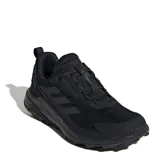 Championes de trekking Adidas Terrex Anylander, color negro, con diseño de malla transpirable y refuerzos sintéticos. Presentan suela con relieve para mayor tracción y logo Terrex en la lengüeta y el talón.