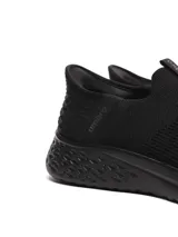 Championes slip-on negros de Umbro, con capellada de tejido flyknit y suela de phylon.