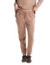 Jogger deportivo de corte holgado, con cintura elástica y lazo de ajuste, bolsillos laterales y puños elásticos en los tobillos.