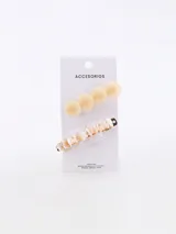 Pack de dos broches para el pelo. Uno de ellos presenta un diseño con esferas lisas en tono crema, mientras que el otro cuenta con una base metálica decorada con pequeñas piezas de nácar y piedras en tonos claros.