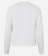 Blusa de pijama de manga larga con cuello redondo, confeccionada en tejido rib con estampado de cuadros en tonos claros.