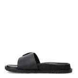 Sandalias Miss Carol Ciana de tipo slide, color negro, con una tira ancha en el empeine decorada con una hebilla metálica grande y texturizada. Presentan una suela plana y cómoda para uso diario.