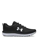 Championes de running Under Armour Charged Assert 10, color negro con logo lateral en blanco y suela con tecnología Charged Cushioning en color blanco.