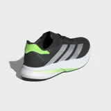 Championes de running Adidas modelo Duramo Speed 2, color negro con las tres tiras en plateado y detalles en verde lima. Cuentan con una parte superior de malla técnica transpirable, amortiguación Lightstrike ligera y suela de TPU y caucho para mayor tracción.