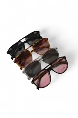 Lentes de sol Malfi con armazón translúcido de acetato gris y cristales oscuros, de diseño tipo aviador con doble puente.