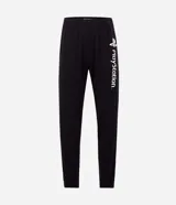 Pijama masculino compuesto por remera de manga larga con cuello redondo y pantalón largo tipo jogger. El conjunto presenta un diseño en color negro con detalles en blanco y estampados oficiales de la marca PlayStation.