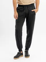 Pantalón de jogging de felpa color gris melange, con corte ajustado, cintura elástica con cordón de ajuste y bolsillos laterales con cierre.