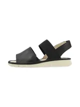 Sandalia Pasqualini modelo Malawi de color negro, con tiras anchas elásticas en el empeine y el talón, plantilla de cuero y suela dentada en tono beige.
