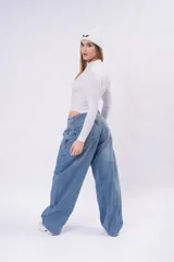 Body de manga larga en color tostado, con diseño ajustado al cuerpo y cuello alto.