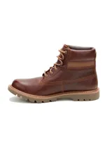 Bota de cuero vacuno con textura granulada, acordonada, con suela de goma dentada y cuello acolchado.