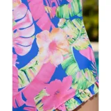 Malla enteriza de la marca United Uy, modelo Majo, con diseño estampado floral en tonos fucsia, verde y azul sobre fondo azul. Presenta escote en V, espalda cruzada con tirantes finos y detalle de volados sutiles en los laterales de la parte inferior.