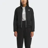 Campera deportiva Reebok Identity para mujer, color negro, con cierre frontal y cuello alto. Presenta ribetes blancos a lo largo de la cremallera y el dobladillo, y un logo Vector grande en la espalda.