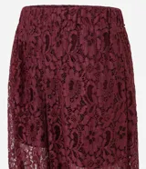 Pantalón aladín de encaje floral bordó, de calce amplio con cintura elástica y puños ajustados en los tobillos.
