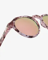 Gafas de sol Hawkers unisex, modelo Warwick, con montura redonda Carey Grey y lentes Rose Gold.
