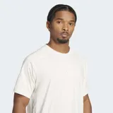 Remera deportiva blanca de corte holgado, cuello redondo y mangas cortas. Confeccionada en tejido Adisoft suave y elástico con tecnología CLIMACOOL.