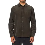 Camisa de manga larga confeccionada en pana de algodón, con corte clásico, cierre frontal de botones y bolsillo en el pecho.