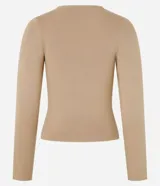 Blusa de manga larga confeccionada en tejido jacquard, con cuello redondo y diseño ajustado al cuerpo.