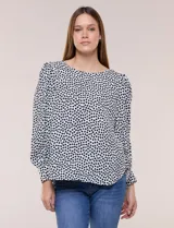Blusa de manga larga abullonada con estampa geométrica en blanco y negro, escote redondo y puños anchos.