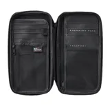 Billetera Rip Curl modelo Flight Travel, color negro, de diseño rectangular con cierre perimetral y el logo de la marca estampado en el frente.