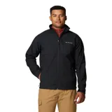 Chaqueta softshell Columbia modelo Ascender, color negro, con cuello alto, cierre frontal completo y bolsillos con cierre, incluyendo uno en el pecho. Incorpora tecnología Omni-Shield resistente al agua y al viento.