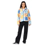 Campera de polar con cierre frontal, cuello alto y bolsillo en el pecho. Presenta un diseño estampado de bloques con motivos botánicos en tonos pasteles y vibrantes.