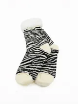 Par de medias térmicas con interior de sherpa, diseño de rayas horizontales en blanco y negro, con puntera y talón en color crema y suela antideslizante.