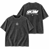 Remera oversize color negro con efecto lavado acid wash, de manga corta, con diseño gráfico estampado en el pecho y la espalda de la marca La Ola.