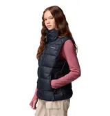 Chaleco acolchado Columbia de color negro con cuello alto, cierre frontal y bolsillos laterales con cremallera. Cuenta con tecnología térmica reflectante Omni-Heat y aislamiento sintético reciclado.
