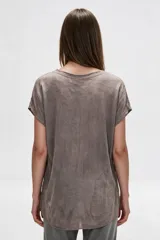 Blusa de algodón holgada en color verde, con cuello redondo y mangas cortas.