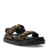 Sandalias de plataforma baja Miss Carol modelo Naira, con capellada de animal print tipo leopardo, dos tiras ajustables con hebillas doradas y suela negra dentada.