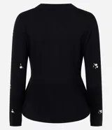 Cardigan negro de punto con bordado floral delicado, mangas largas, escote redondo, cierre frontal con botones y diseño peplum en la cintura.