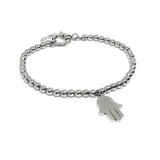 Pulsera de acero quirúrgico compuesta por pequeñas cuentas esféricas y un dije colgante en forma de mano de Fátima (Hamsa).