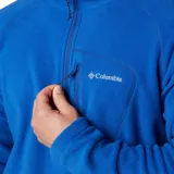 Buzo polar Columbia modelo Fast Trek III, color azul, con cuello alto, cierre frontal parcial y bolsillo con cierre en el pecho.