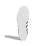 Championes Adidas Gazelle de gamuza azul marino con las tres tiras laterales blancas y detalles dorados.