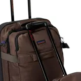 Bolso de viaje Rip Curl modelo F-Light Global 100L, color marrón con detalles en negro. Cuenta con ruedas, manija retráctil y múltiples compartimentos.