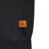 Buzo negro con capucha, de corte holgado y con un bolsillo tipo canguro. Presenta un estampado circular con motivos geométricos en tonos violeta, naranja y verde.