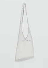 Bolso tipo tote de tamaño pequeño, confeccionado en tejido transparente con lentejuelas bordadas. Presenta un diseño triangular con asa de hombro integrada.