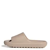 Chanclas tipo slide Adidas Adilette Lumia, color beige, con diseño ergonómico de una sola pieza, suela con ranuras flexibles y logo de la marca grabado en el lateral.