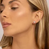 Aros de plata 925 con piedra topacio azul redonda engarzada con cuatro grifas.