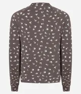 Blusa de pijama de manga larga con cuello redondo y puños ajustados, confeccionada en tejido rib con estampado floral pequeño.