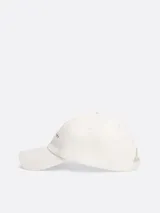 Gorra de béisbol blanca de algodón con logo de Tommy Jeans bordado en el frente.