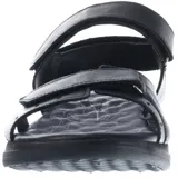 Sandalias de cuero color marrón con ajuste de velcro en el empeine y el talón. Presentan una suela de goma ergonómica en tono gris y logo de la marca grabado en la tira superior.