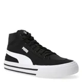 Championes urbanos Puma modelo Court Classic Vulc Mid FS, de caña media, confeccionados en lona negra con la icónica franja lateral en color blanco. Presentan cierre de cordones, cuello acolchado y suela vulcanizada blanca con líneas decorativas negras.