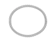 Esclava rígida de acero con diseño de esferas texturadas y cierre de seguridad integrado.