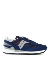 Championes Saucony modelo Shadow Original, color azul marino con detalles en gris y blanco. Presentan una combinación de materiales en gamuza y malla, con suela de goma y diseño clásico de running retro.