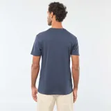 Remera de manga corta y cuello redondo en color azul, con estampado frontal gráfico que incluye un casco de fútbol americano y el texto Tuscaloosa Guardians American Soccer Club Alabama.